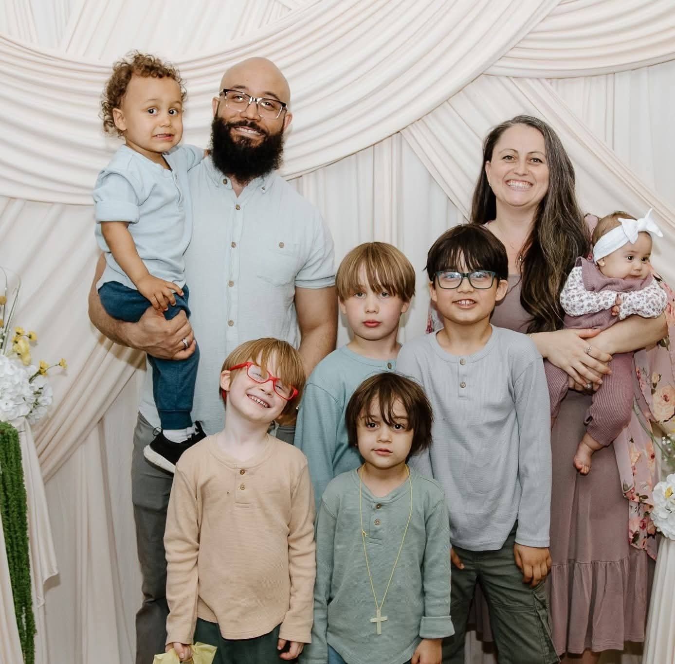Britney and Zackery Duclos with their six children, co-owners of Avenwood Cabins