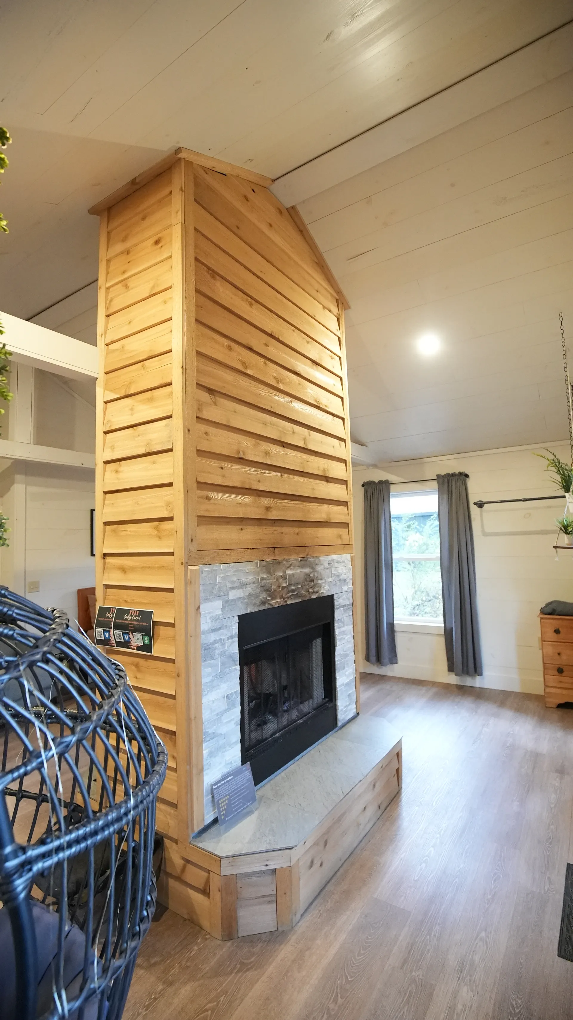 Bedroom with queen bed, nightstands, and vaulted shiplap ceiling at Butterfly Ridge cabin