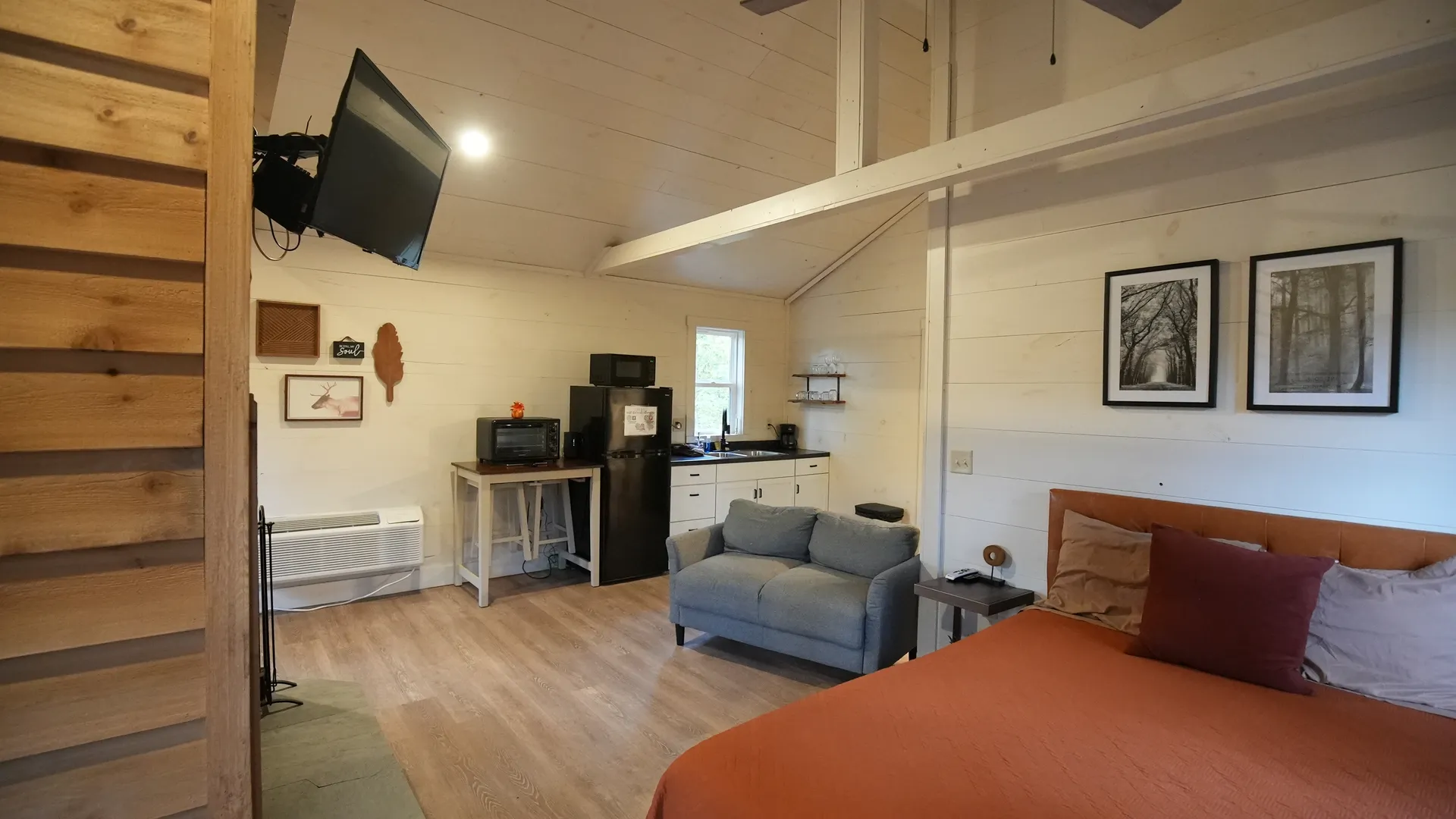 Open floor plan with kitchen, dining, fireplace, and living area at Butterfly Ridge cabin