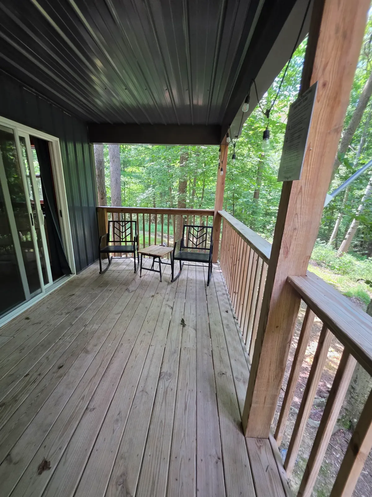 Deck area showing the hot tub corner and seating at Dogwood Run cabin