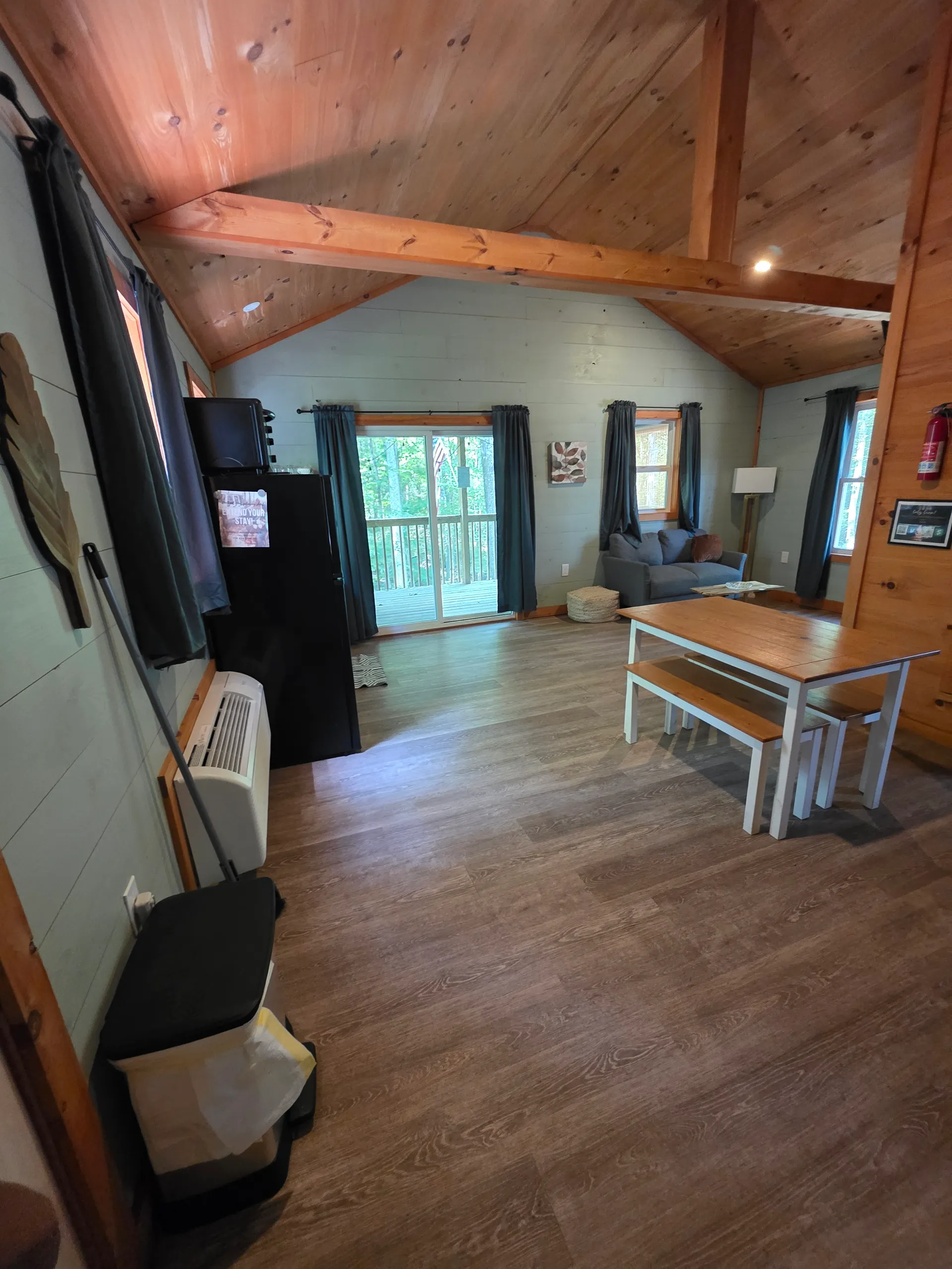 Interior viewed from the bedroom area toward the kitchen and living room at Dogwood Run cabin