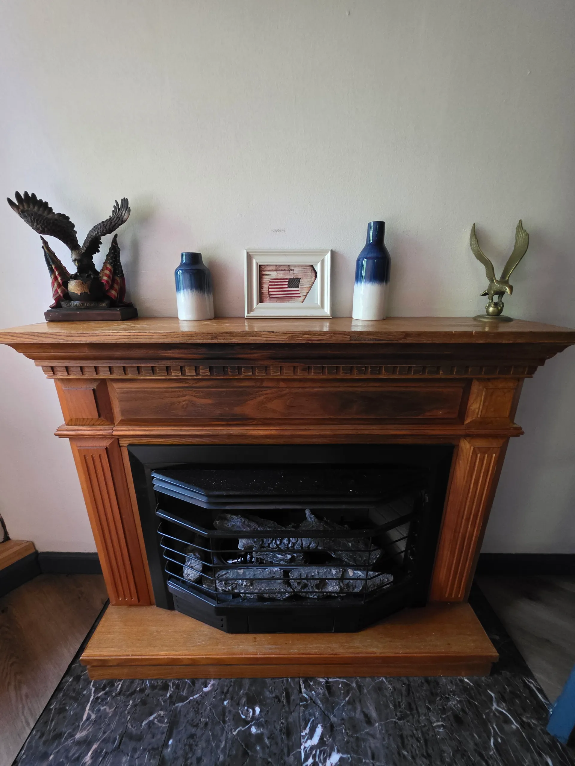 Elegant wooden fireplace with eagle decor on mantel inside Eagles Nest cabin