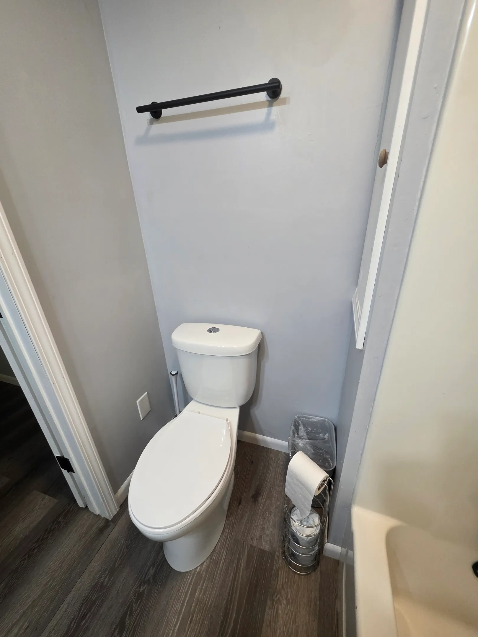 Half bathroom with toilet and towel bar at Getaway House cabin