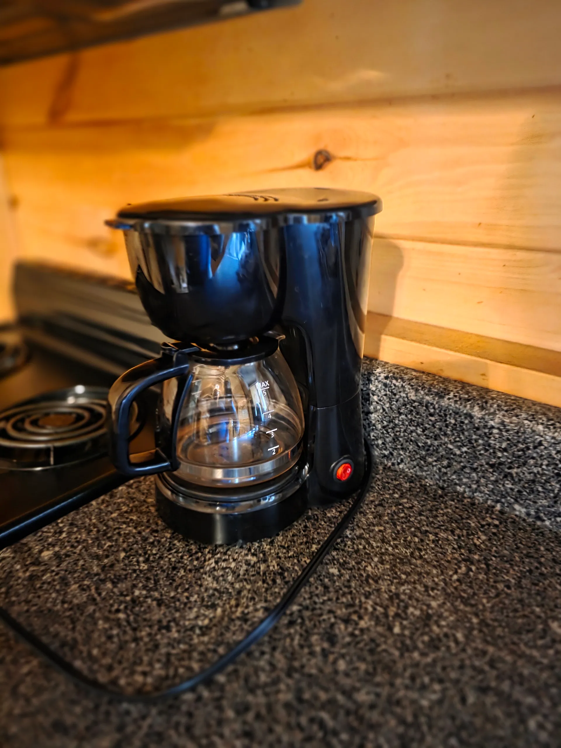 Coffee maker on granite countertop in the kitchen of Settlers Roost cabin